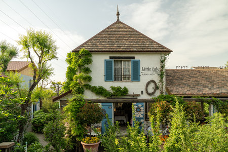 Little cafe called Gardenia Shevardnadze in Tbilisi, decorated with potted plants and trees.