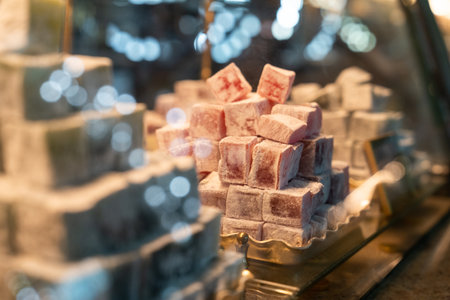 Turkish delight in shop window. Oriental sweetness, pink cubes stacked in pyramid. Yummy dessertの写真素材
