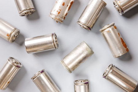 spent used rechargeable Nickel Metal Hydride (Ni-MH) battery, grey background, flat layの写真素材