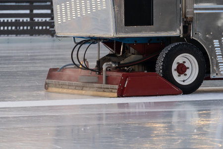 Polished ice maintenance machine ice preparation at rink between sessions in outdoor ready for match