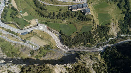 Aerial photo of the Pyrenean mountains in the summer. There are green mountains with trees and...