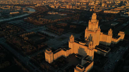 Stalin's skyscraper from drone, Moscow University on sunset in spring. Moscow river. Russia. Aerial...
