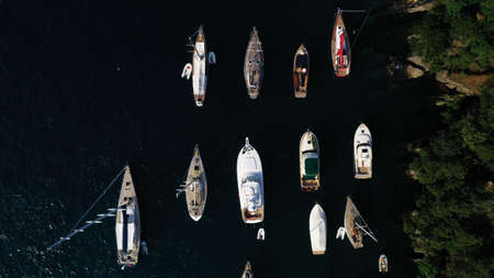 Aerial view of boats in dark blue sea. Portofino, Italy from drone.