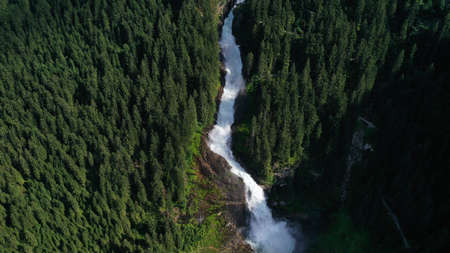 Aerial view of Krimml waterfall, cascades. Landscape with spruces, fir tree forest, stones, water...