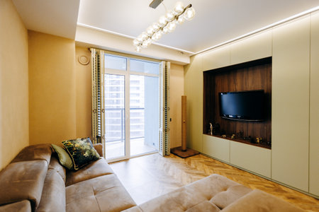 Modern Living Room Interior featuring a Cozy Sofa and Stylish TV Setup for comfort and aestheticsの写真素材