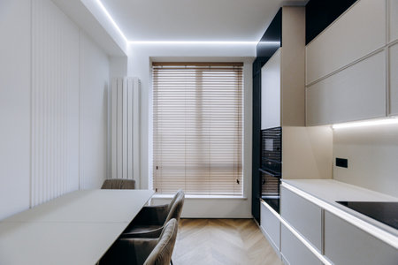 Explore the beauty of a Modern Minimalist Kitchen Design that features Elegant Lightingの写真素材