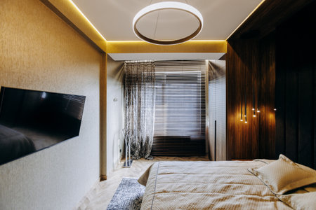 A Modern Bedroom Interior featuring an Elegant Design and Soft, Ambient Lighting Effectsの写真素材