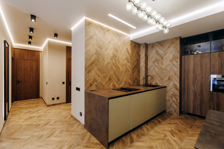 The modern kitchen interior features exquisite and elegant wood finishes that enhance beautyの写真素材