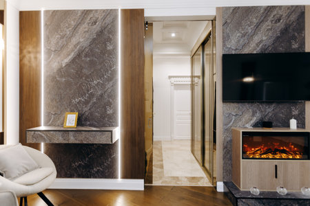 A cozy living room featuring a fireplace alongside a flat screen tvの写真素材