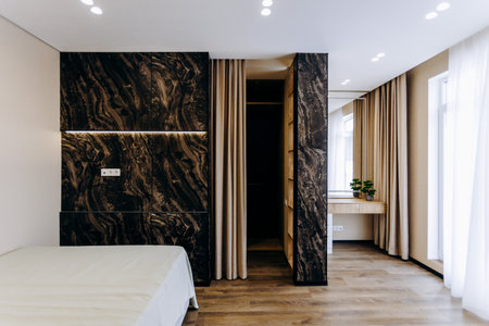 A cozy bedroom featuring a comfortable bed and an inviting walkin closetの写真素材