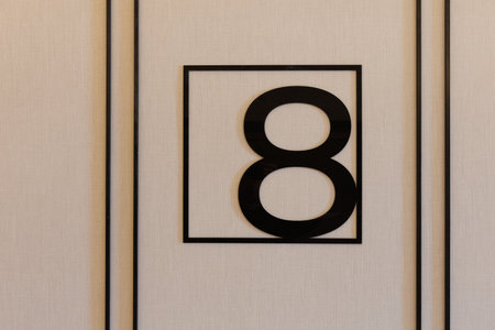 A black and white sign featuring the number eight prominently displayed on itの写真素材
