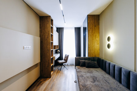 In the center of the room, there is a bed positioned neatlyの写真素材