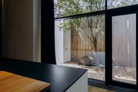 A kitchen that features a large windowの写真素材