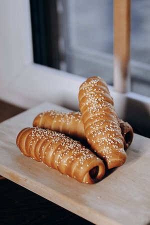 Freshly Baked and Delicious Pastry Rolls with a Crunchy Sesame Topping for Enjoymentの写真素材