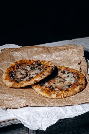 Experience the Delight of Delicious Homemade Pizzas Served on Rustic Paper Plates