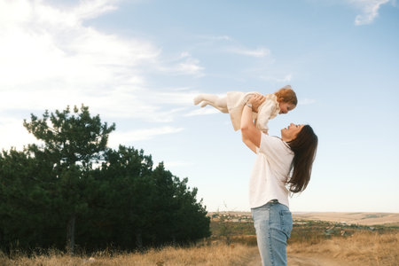 Joyful Mother and Child Creating Lasting Memories Together, Bonding and Exploring Natureの写真素材