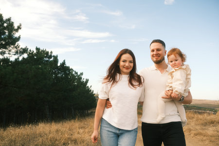 A Beautiful Family Portrait Set in Nature Capturing Joyful Moments Spent Togetherの写真素材