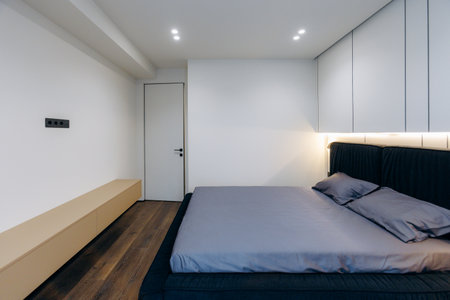 A Modern Minimalist Bedroom Concept Featuring an Elegant and Thoughtful Design Aestheticの写真素材