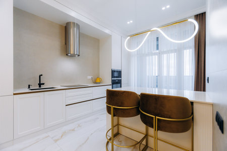 Discover the Elegant and Modern Kitchen Interior featuring Stylish Bar Stools with Unique Lighting