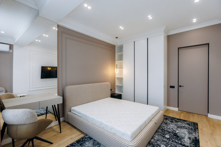A Modern Minimalist Bedroom that Features an Elegant Design with Sophisticated Neutral Colors