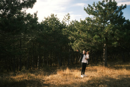 Experience a Serene Journey through a Beautiful Forest Walk immersed in Natures Embraceの写真素材