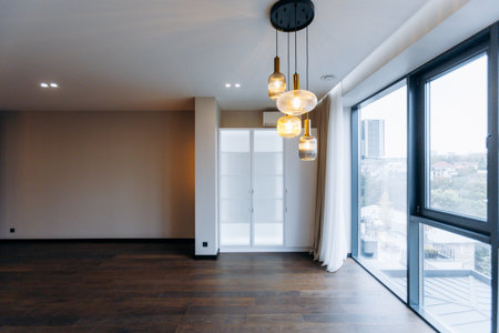 A Beautiful Modern Living Room Featuring Elegant Lighting and a Stunning Open Viewの写真素材