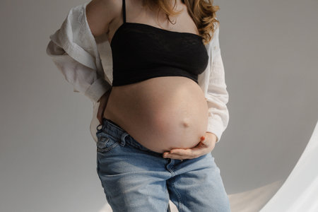Everyday confidence expressed through casual pregnancy portraitの写真素材