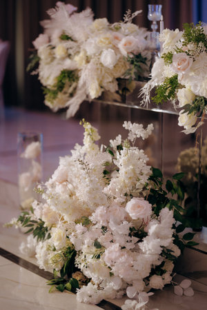 Neutral tones with romantic lighting enhance floral displayの写真素材
