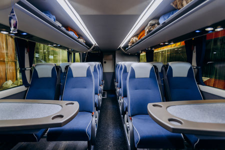 contemporary bus interior, interior of peaceful modern bus with illuminated windows and orderlyの写真素材
