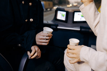 Flight attendants relaxing with beverages and conversationの写真素材