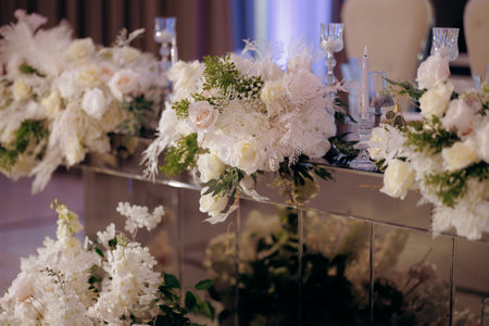 Decorative gold vase features vibrant floral arrangementsの写真素材