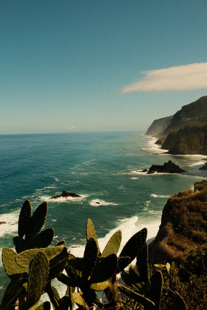 Sundrenched promontory with ocean and rugged coastlinesの写真素材