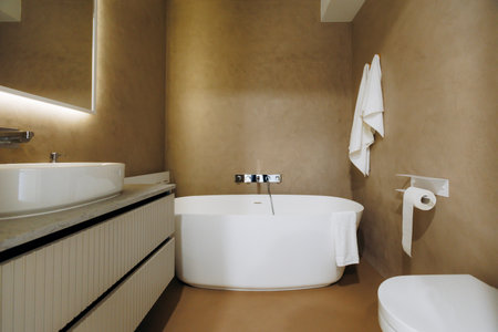 Serene spa retreat bathroom with oversized fixtures and soft lighting