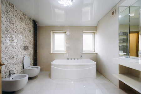 Charming bath area featuring floral decor and soaking tubの写真素材