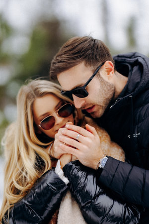 Fashionable partners in cold weather with vibrant accessoriesの写真素材