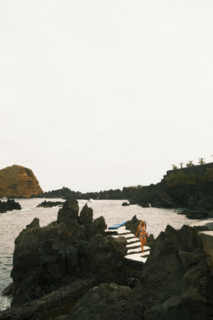 Tidepool areas featuring carved stairs and protective rockの写真素材