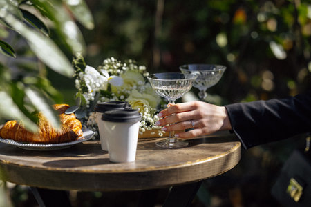 Sunlit outdoor breakfast with elegant beverage arrangements
