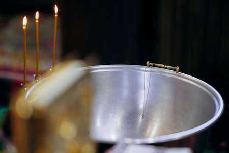 Graceful indoor ritual scene illuminated by candlelight