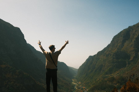 Explorer enjoying sunrise, Hiker gazing at morning landscape