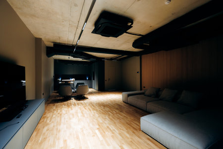 Expansive sitting area with plush sofa and moodenhancing lightsの写真素材