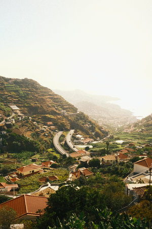 Serene landscape featuring curving highway and coastal view