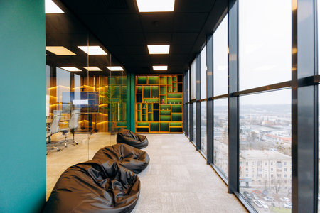 Luminous Reading Zone Equipped With Numerous Beanbags And Towering Bookshelves For Leisure And Study