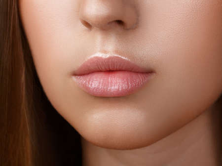 Perfect lips. Sexy girl mouth close up. Beauty young woman Smile. Natural plump full Lip. Lips augmentation. Close up detailの写真素材
