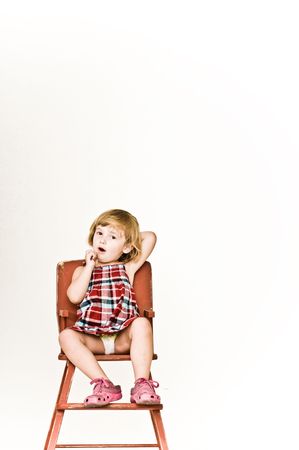 A three year old, girl making faces.の写真素材