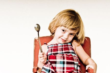 A three year old, girl making faces.の写真素材