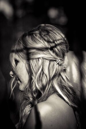 A bride during the ceremony, listening to the officiate.の写真素材