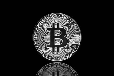 Bitcoin crypto currency coin in isolated black background.の写真素材