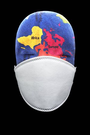 Health mask depicting global pandemic breakout in the worldの写真素材