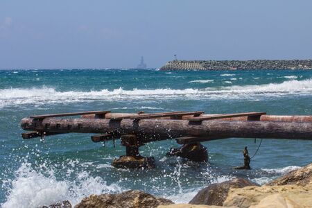 seascape with old pier and horizonの写真素材