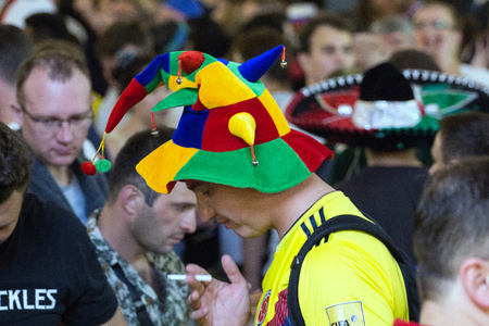2018.07.15, Moscow, Russia. World cup 2018. Moscow FIFA 2018. Emotions of football fans on Moscow streets. Men wearing colorful hat.のeditorial素材